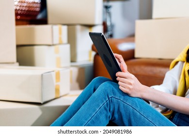 Hand Of SME Small Business Shop Owner Working On Digital Tablet Checking Customer Order. Online Store. Parcel Box Ready To Delivery. Social Media, E-commerce, Internet Shopping. Copy Space