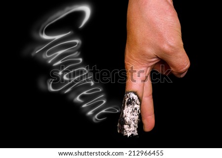  hand with smoke cigarette isolated on a black background, symbolizing gangrene