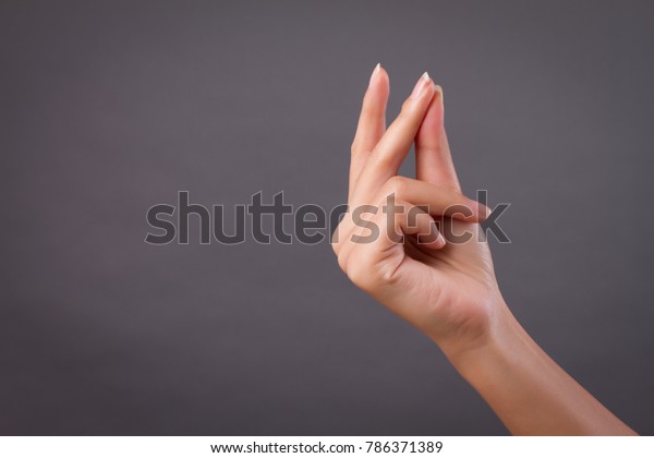 hand snapping finger snap studio isolated; yes,\
ok, accepting hand, finger snapping for good creative idea;\
conceptual woman hand snap action gesture concept; woman hand\
talent model studio\
isolated