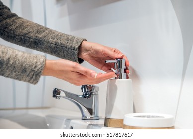 A Hand Soap With Pumping Lotion From Bottle. Female Hands Using Wash Hand Sanitizer Gel Pump Dispenser.