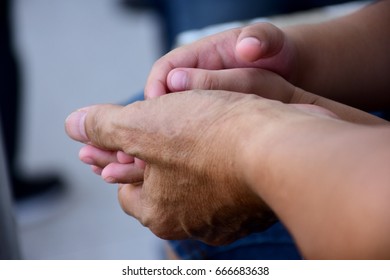 The hand of son is hold by his father with love and care - Powered by Shutterstock