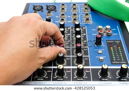 Hand and sound mixing console. Element of design.
