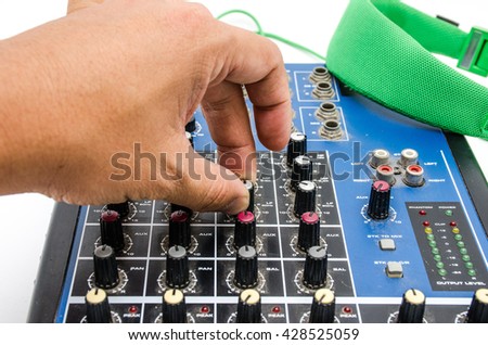 Hand and sound mixing console. Element of design.
