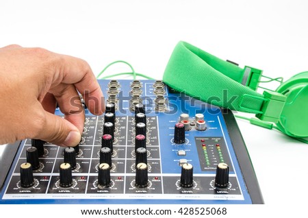 Hand and sound mixing console. Element of design.
