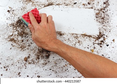 Hand With Sponge Cleans A Dirty Surface