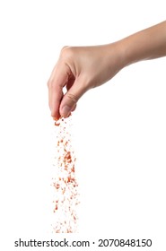 Hand Sprinkling Cayenne Pepper Isolated On White Background