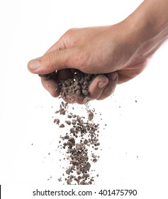 Hand Sprinkling Soil On White Background