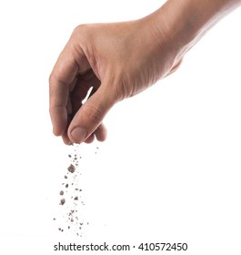 Hand Sprinkling Soil On White Background