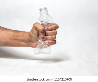 Hand Squashing Empty Plastic Water Bottle Resembling Ban Of Single Use Plastic Recycle