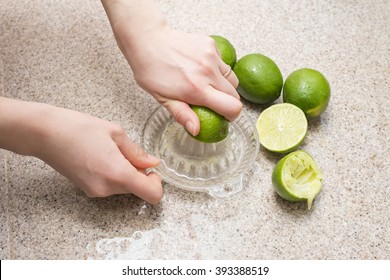 Hand to squeeze the lime juice
