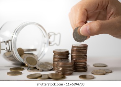 Hand stack coins,  concept for Saving money, growing business and wealthy.