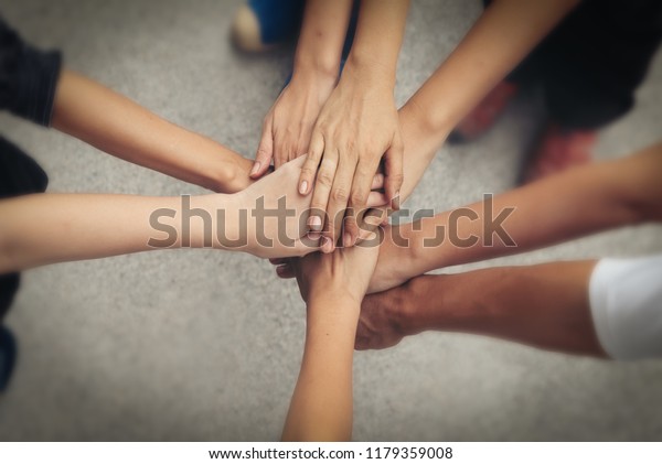 hand-stack-and-hold-together-in-team-for-success-something-or-take-care