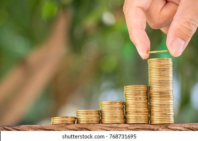 Hand Are Stacking With Coins To Save The Money Invest For The Future Concept Business, Financial, Tax And Bonus.