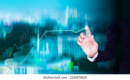 Hand staff point on trend line of Bitcoin crypto currency, blur data numeric analysis forex  growth graph stock market.symbols. business or finance. plan investment income for 2023 new year concept. - Shutterstock ID 2134378529