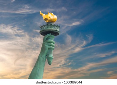 Hand of Statue of Liberty with beautiful cloudy background - Powered by Shutterstock