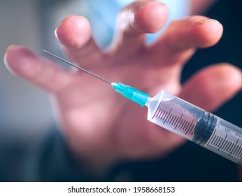 Hand Stealing A Medical Syringe