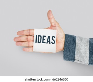 Hand with Sticky Note Showing Creative Ideas Design Word