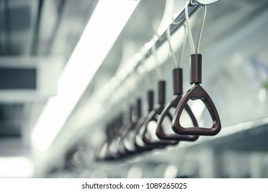 Hand Straps On Subway. Hand Grip Strap In Public Transportation. Selective Focus Of Perspective Handle Of Subway For Safety. Business Man Commutes With Hand Straps On The Seoul Metro Every Day.