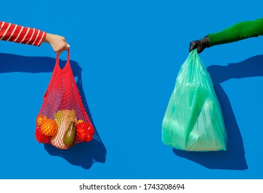 A Hand With A String Bag Filled With Fresh Vegetables And Fruit  Vs Hand In A Disposable Glove Holding A Plastic Bag. Zero Waste Against Covid. Return Of Disposable Plastic During Epidemic.