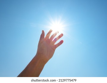Hand to sun. Element of design. - Shutterstock ID 2129775479