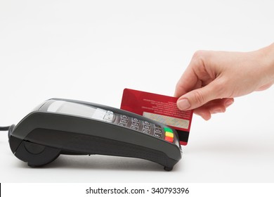 Hand Swipe Red Credit Through Payment Terminal 