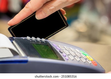 Hand Swiping Blank Credit Card In Store