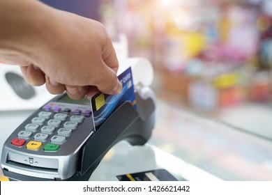 Hand Swiping Credit Card In Store