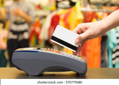 Hand Swiping Credit Card In Store