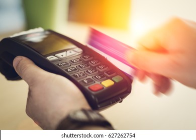 Hand Swiping Credit Card In Store