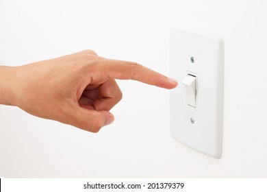hand switching light power switch on or off.