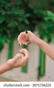 Hand Symbols With Green Leaf Background And Do Separate Ways