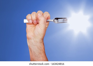 Hand with table fork