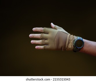 Hand In Tactical Glove And Watch