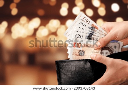hand taking money notes out of wallet