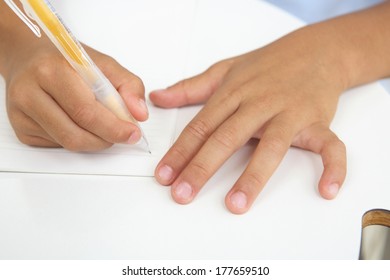 Hand taking notes