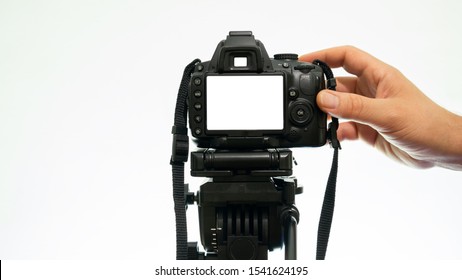 Hand Taking Pictures With A DSLR Camera. Mockup Camera View