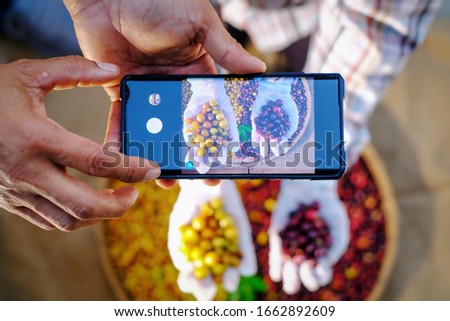 Similar – Image, Stock Photo Young hands taking photos with smartphones to vegetable skewers