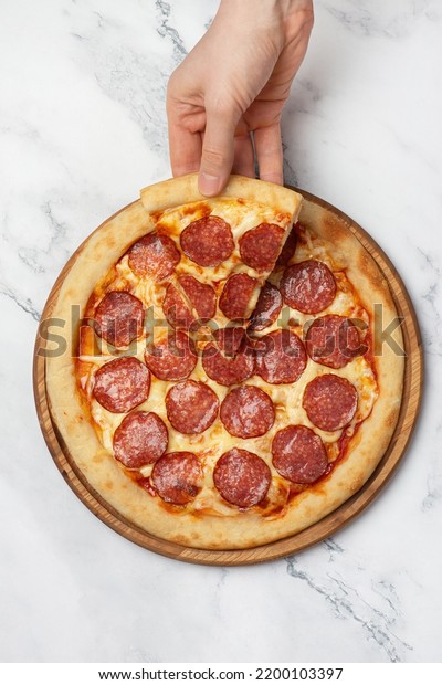 Hand Taking Slice Pepperoni Pizza On Stock Photo 2200103397 Shutterstock