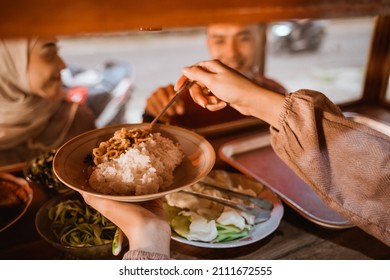 Hand Taking Some Food In Traditional Food Stall