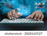 Hand taps keyboard as holograms float above. Data streams, graphs, and locks glow around the hand. Blue digital overlays suggest security and analysis