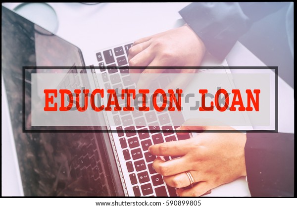 Hand and text  EDUCATION LOAN with vintage
background. Technology
concept.