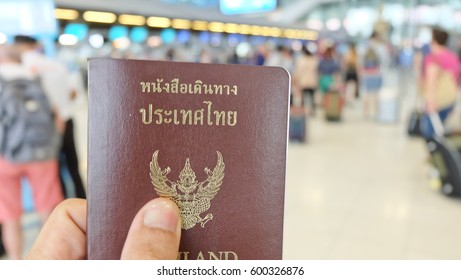 Hand That Show The Thailand Passport At Suwannaphum Airport.