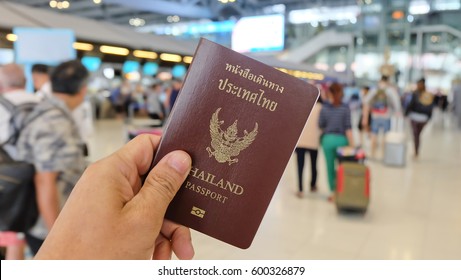 Hand That Show The Thailand Passport At Suwannaphum Airport.