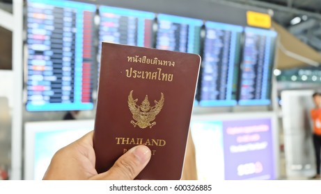 Hand That Show The Thailand Passport At Suwannaphum Airport.