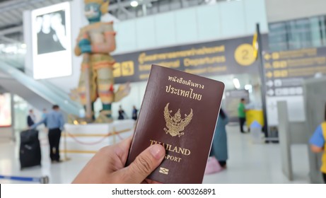 Hand That Show The Thailand Passport At Suwannaphum Airport.