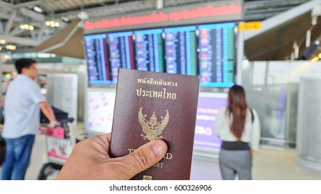 Hand That Show The Thailand Passport At Suwannaphum Airport.