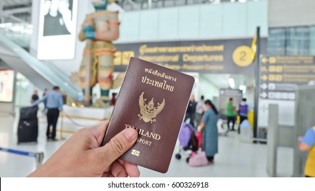 Hand That Show The Thailand Passport At Suwannaphum Airport.