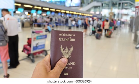 Hand That Show The Thailand Passport At Suwannaphum Airport.