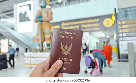 Hand That Show The Thailand Passport At Suwannaphum Airport.