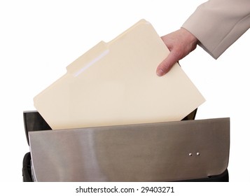 hand throwing file in trash